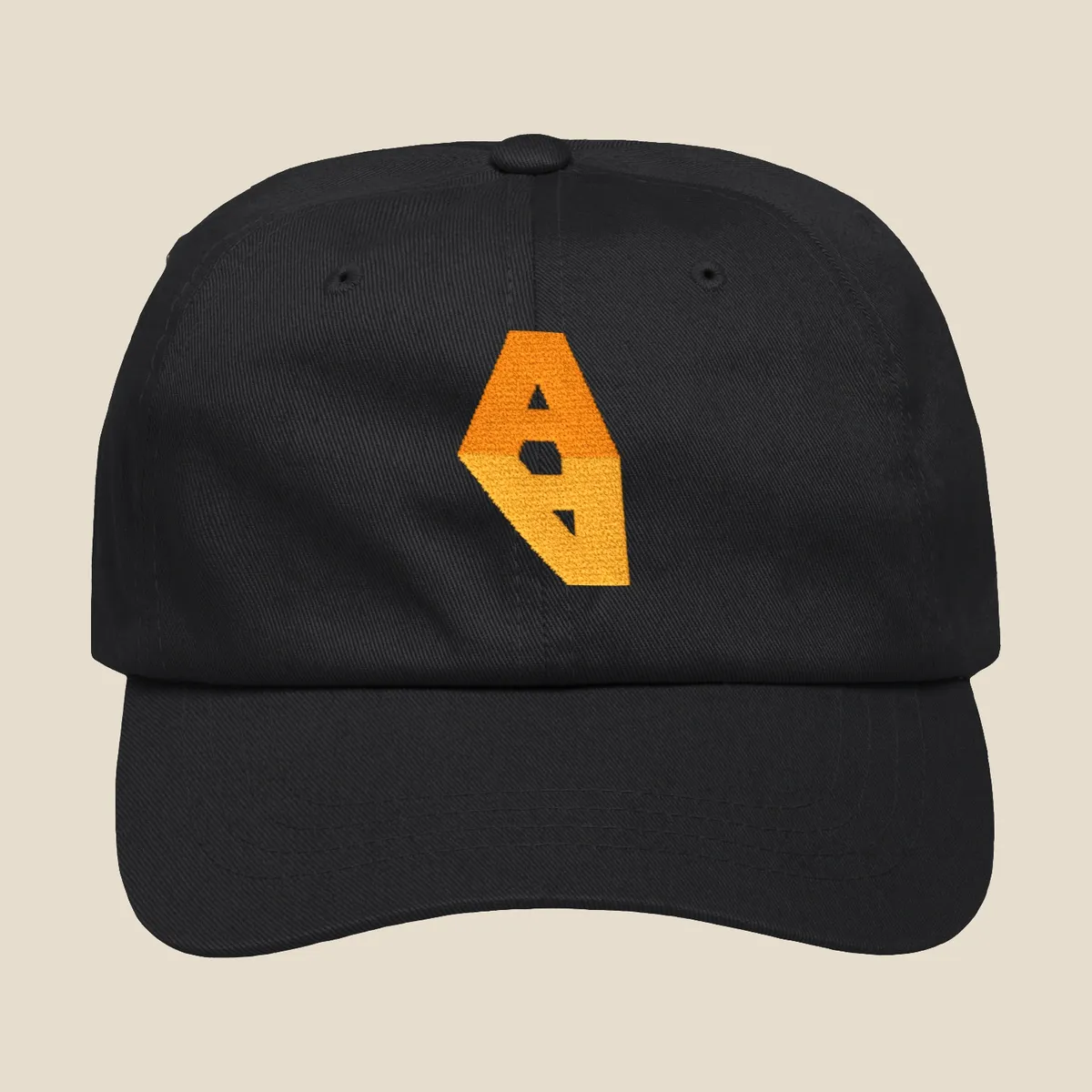 A black dad hat with the Augmented Actor A embroidered in orange and amber